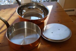 Interior finishes on stainless-lined pans